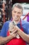 Salesman Looking At Rabbit In Pet Store