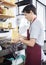 Salesman Packing Cheese At Grocery Store