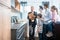 Salesman showing family the features of a new kitchen