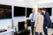 Salesman Showing Flat Screen Television To Couple In Store