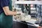 Salesman Slicing Blue Cheese With Knife