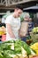 Salesman standing on stall fresh food