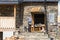 A salesman stands on the steps near a small family store in Ushguli village in Svaneti in the mountainous part of Georgia