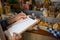 Salesman writing on clipboard at counter