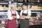 Salesmen With Arms Crossed In Cheese Shop