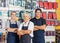 Salesmen Standing Arms Crossed In Hardware Shop