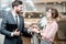 Salesperson giving car keys to a woman