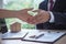 The salesperson shake hands with the landlord after negotiating a living agreement