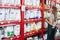 Saleswoman Arranging Food Packages In Pet Store