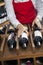 Saleswoman Arranging Wine Bottles In Rack