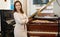 Saleswoman assistant in piano music store
