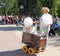 Saleswoman of cotton candy in the square