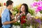 Saleswoman and customer in flower shop