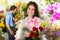 Saleswoman and customer in flower shop