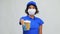 Saleswoman in face mask with takeaway coffee cup