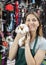 Saleswoman Holding Cute Guinea Pig At Store