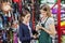 Saleswoman Holding Rabbit With Girl At Pet Store