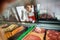 Saleswoman Looking At Variety Of Meat Displayed In