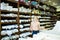 Saleswoman offering cloth in textile shop