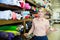 Saleswoman offering cloth in textile shop