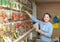 Saleswoman with seeds at store