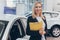 Saleswoman working at car dealership