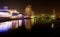 Salford quays at night, Lowry and millennium bridge, blurred reflection on the water, Manchester UK