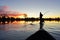 Saling in the Okavango delta at sunset, Botswana