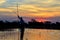 Saling in the Okavango delta at sunset, Botswana