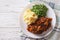 Salisbury steak with gravy, mashed potatoes and green peas. hori