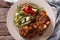 Salisbury steak with mushroom sauce and vegetable close-up. hori