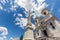 Sallustiano Obelisk against blue sky above Spanish Steps, in front of The church of the Santissima TrinitÃ  dei Monti in Rome