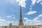 Sallustiano Obelisk against blue sky above Spanish Steps, in front of The church of the Santissima TrinitÃ  dei Monti in Rome