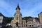 Salmchâteau, Belgien - 10 10 2023: Main street with the stone church and gray stone houses