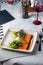 Salmon Appetizer, Carpaccio, Salmon Slices with Cream Cheese and Salad on Bright Background