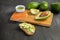 Salmon on bread slices gourmet appetizer with avocado. Fresh salmon   and avocado sandwich. Healthy food concept.