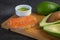 Salmon on bread slices gourmet appetizer with avocado. Fresh salmon   and avocado sandwich. Healthy food concept.