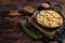 Salmon Bucatini pasta with creamy spinach sauce and fish fillet. Wooden background. Top view. Copy space