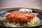 Salmon burger and cabbage salad in bowl on wooden table. Salmon fish cake and vegetables.