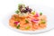Salmon carpaccio with salad on plate