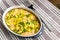 Salmon clafoutis in the oval baking pan. View from above