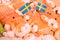 Salmon, cod, shrimps and black pepper on a wooden board. Swedish flags. National food
