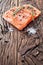 Salmon filet on a wooden carving board.