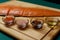 salmon fillet, pink salt, oil, colorful pepper and dried carrots in glass bowls