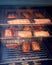 Salmon fillets smoking in a smoker