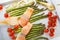 Salmon fish and green aspargus, cherry tomatoes and fennel