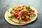 Salmon fish tacos with mango, avocado, tomato, spring onion and lime. Mexican food