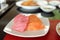 Salmon and maguro sashimi on white dish
