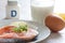 Salmon, milk, eggs and cheese, in background vitamin D. Natural sources of vitamin D and supplement