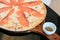 Salmon pizza hand make is tasted